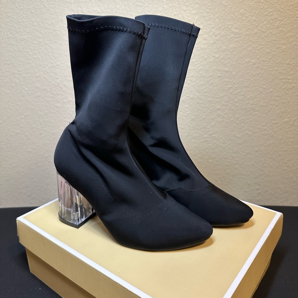 Black sock boots with clear heel. Brand new, 3 inch heel tall.